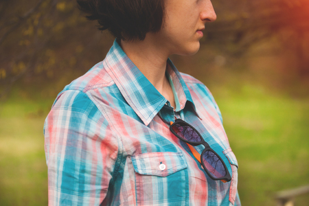 Shirt in pink and blue cage with glasses on the collar.の写真素材