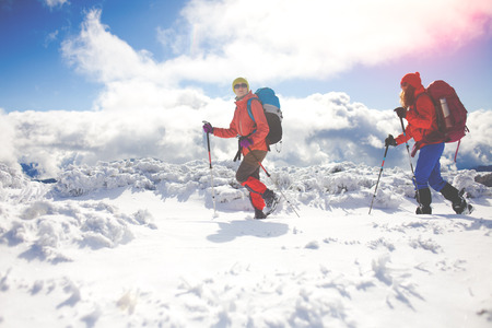 tourists walk in the snow in the mountains during the winter holidays in the mountains, winter in the Ukrainian Carpathians.
の写真素材