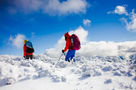 tourists walk in the snow in the mountains during the winter holidays in the mountains, winter in the Ukrainian Carpathians.
の写真素材