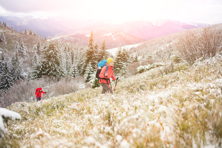 tourists walk in the snow in the mountains during the winter holidays in the mountains, winter in the Ukrainian Carpathians.
の写真素材