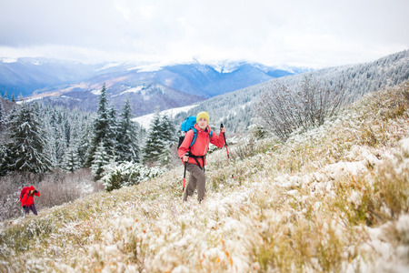 tourists walk in the snow in the mountains during the winter holidays in the mountains, winter in the Ukrainian Carpathians.
の写真素材