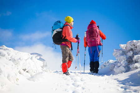 tourists walk in the snow in the mountains during the winter holidays in the mountains, winter in the Ukrainian Carpathians.
の写真素材