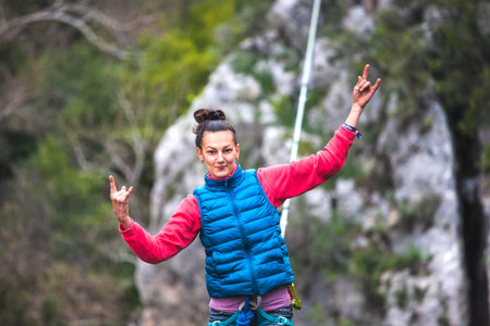 Highliner on a rope. Highline on a background of mountains. Extreme sport on the nature. Balancing...
