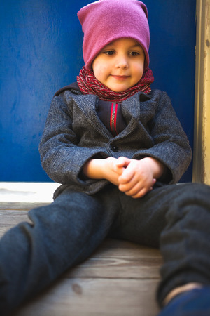 Portrait of a boy. Stylish child in a jacket and hat. Cute baby.の写真素材
