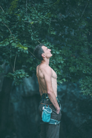 A male climber resting after a workout. strong and beautiful athlete. portrait of a rock-climber.の写真素材