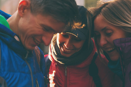 Friends take a selfie. Three friends are walking through the beautiful old town. Travel to European...