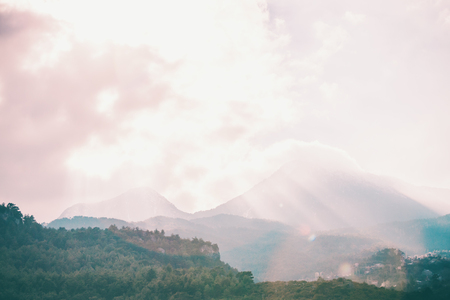 Beautiful mountains in the fog. Turkish mountain landscape. The sun's rays pass through the fog.の写真素材
