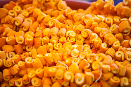 Candied orange peel. Candied fruits on the counter of the Turkish market. Rolled orange peel. Turkish sweets.の写真素材