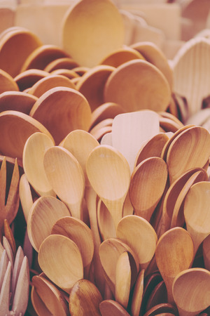 Wooden spoons close up. Kitchen appliances on the market counter. Cutlery made of wood.の写真素材