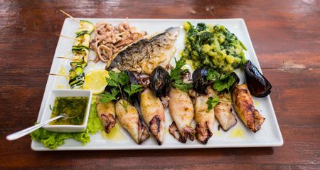 Seafood plate. Fish restaurant. Mediterranean Kitchen. Squids, mussels and octopus with grilled...