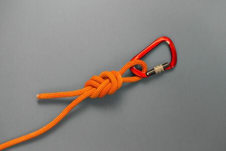 Carabiner and knot from a climbing rope. Equipment for climbing and mountaineering. Knot eight.の写真素材