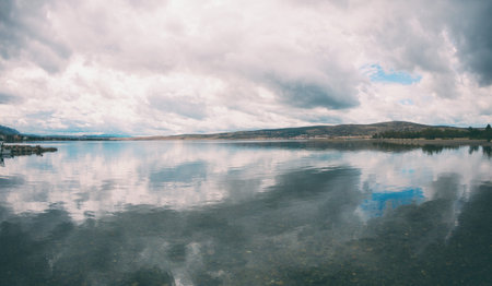 Sea coast of Croatia. Sea and sky with clouds. Calm water.