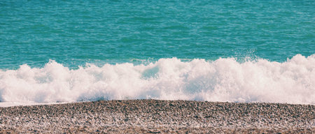 Beautiful sea waves. Ocean coast. Rest on the sandy coast. Sea foam. The wave is breaking on the...