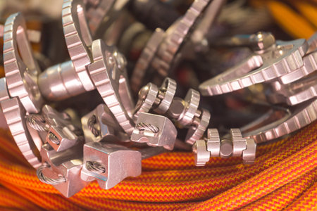 climbing equipment folded on an orange rope. modern equipment for climbing in the mountains....