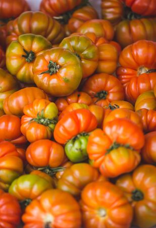 Fresh tomatoes on a market counter. Red and green tomatoes. Vegetables. Proper nutrition. Dietary foods. Turkish bazaar.の写真素材