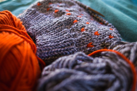Knitting with gray and orange woolen threads, Jacquard knitting, Homemade needlework, Handmade...