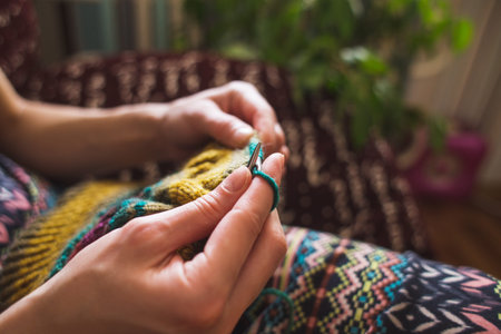 woman knits. home woolen clothes. in her free time, the girl is engaged in a hobby.