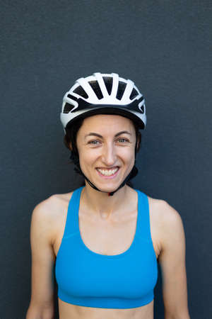 portrait of a sports girl in a bicycle helmetの写真素材