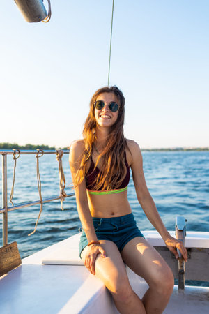 portrait of a young girl with glasses while traveling on a yacht
