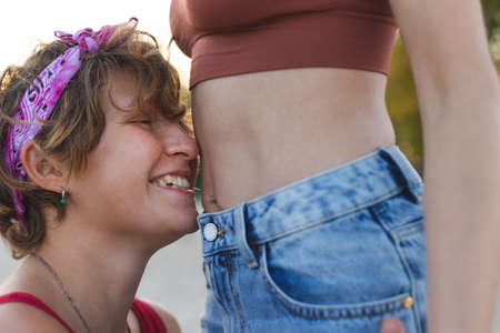 Two girls spend time tenderly together on a walk. Love and attitude. LGBT conceptの写真素材