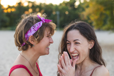 Portrait of a cute lesbian couple. The two girls look at each other. Love and attitude. LGBT conceptの写真素材