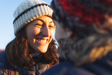 mom and son hug and look at each other. portrait of happy mother and son. winter walk along the...