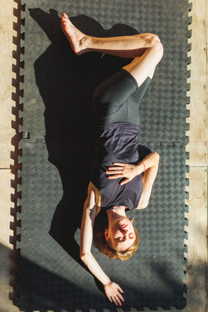 yoga woman. young girl is doing yoga. does yoga. girl doing exercise in yoga class. active...