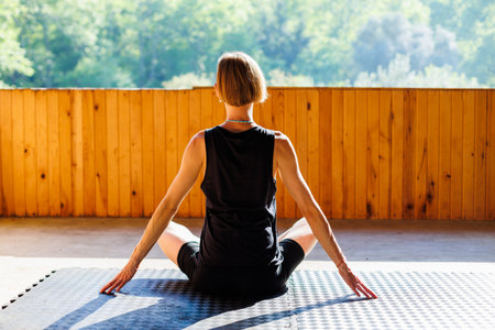 yoga woman. young girl is doing yoga. does yoga. girl doing exercise in yoga class. active lifestyle.の写真素材