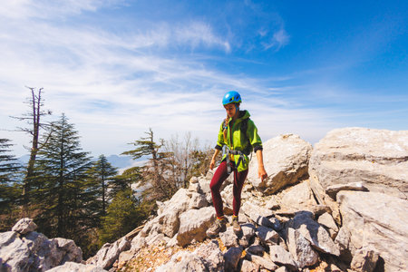 Amazing landscape with a mountain range and a tourist with a backpack in the foreground. mountaineering and climbing. adventure in the mountains.の写真素材