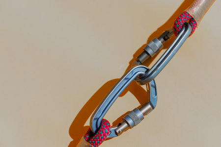 Reliability and safety. carabiner with rope. Equipment for climbing and mountaineering. Safety rope and carabiners.の写真素材