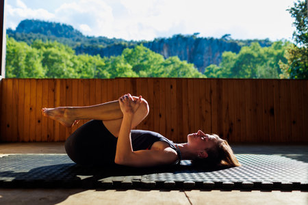 yoga woman. young girl is doing yoga. does yoga. girl doing exercise in yoga class. active lifestyle.の写真素材