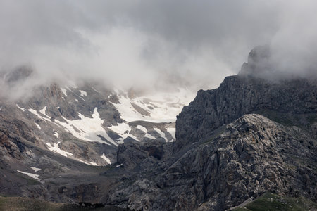 Passing clouds over a landscape in Turkey with snow capped mountains in the background. Landscape of mountain range and mountains. mountaineering in Turkey. Dedegol. Turkey.の写真素材
