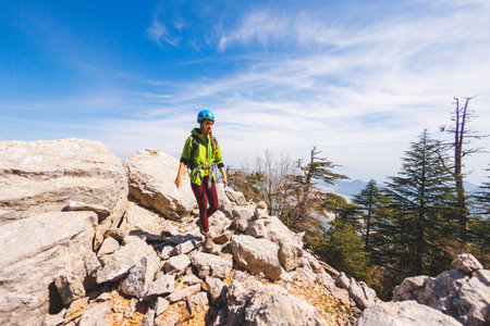 climber goes along the rocky ridge. girl climbing in the mountains. the concept of adventure and hiking in the mountains. Turkey.の写真素材