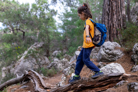 earth day concept. happy boy explores summer forest, travels on vacation. Teach children to love nature. adventure and hikeの写真素材