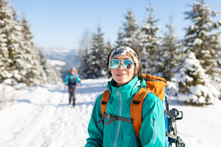portrait of a young girl in winter mountainsの写真素材