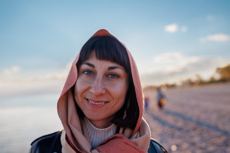 portrait of a young girl. A woman in a headscarf smiles. Beautiful woman wearing headdresses, a...