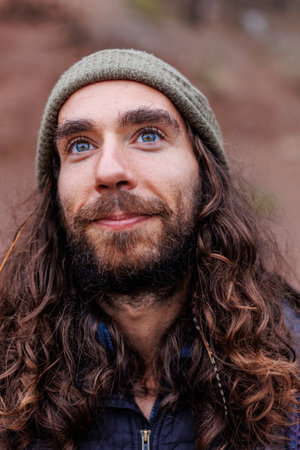 A handsome middle-aged man with long hair with a happy smile on his face. Happy man.の写真素材