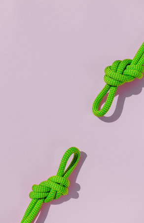 two ropes with secure knots. concept of reliability and safety. climbing rope with a knot lies on a...