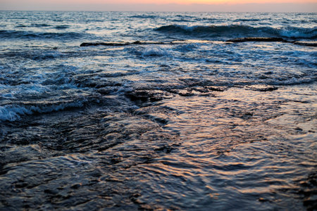 Waves, splashes of water. Dramatic sky after a storm, epic seascape. Nature.の写真素材