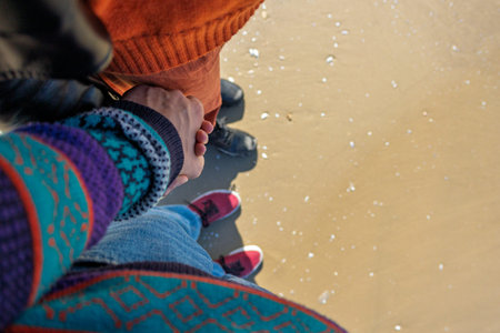 girl and boy holding hands. walk on the beach. travel and vacationの写真素材