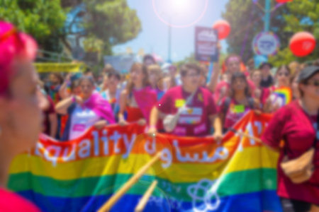 A blurry photo of LGBT parade participants. The movement, the LGBT community. Abstract, blurry,...