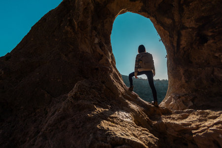 happy woman in mountains. girl traveling in the mountains. trekking and hiking. concept of sport and healthy lifestyle. girl with backpack.の写真素材