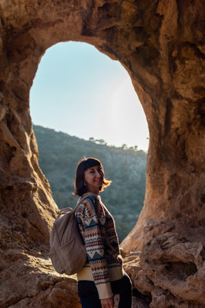 follow me. happy couple traveling. portrait of happy female tourist in mountains. girl smiling. trekking and hiking. sport and healthy lifestyle concept. girl with backpack.の写真素材