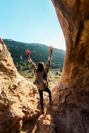 happy woman in mountains. girl traveling in the mountains. trekking and hiking. concept of sport and healthy lifestyle. girl with backpack.の写真素材