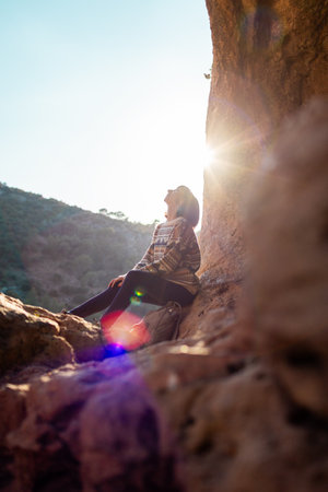 happy woman in mountains. girl traveling in the mountains. trekking and hiking. concept of sport and healthy lifestyle. girl with backpack.の写真素材