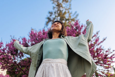 portrait of a happy girl. urban style and fashion. A young brunette is having a happy and fun time, the girl is smiling. Young stylish girl in a shirt. Summer portraitの写真素材