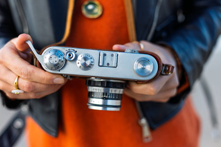 girl travels and photographs landmarks. Stylish girl with film camera. adventures and travels.の写真素材