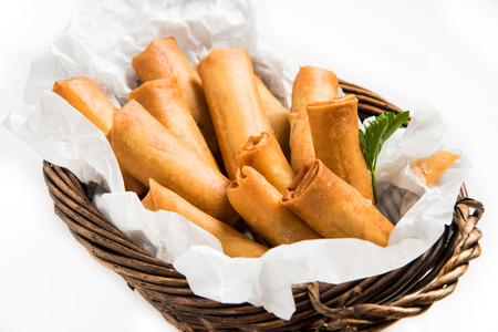 Traditional Asian Fried Spring Rolls with Dipping Sauce on White Backgroundの写真素材
