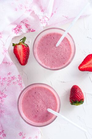 Milk cocktail with strawberries, top viewの写真素材