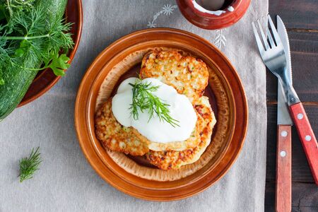 Zucchini fritters and ricotta, top viewの写真素材
